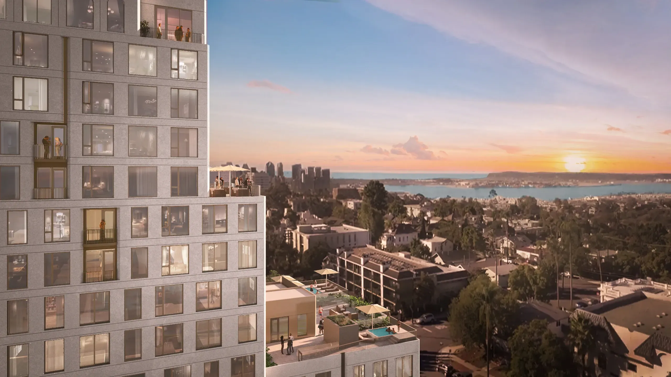 Modern high-rise residential building with sunset waterfront and city skyline view